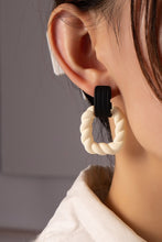 Load image into Gallery viewer, Twisted square hoop drop earrings with holographic effect.
